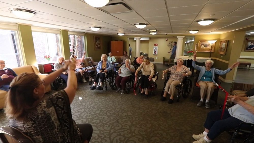 Seniors doing chair exercises at Manoogian Manor