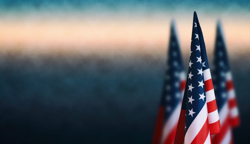 Three American flags on the right side of a background image