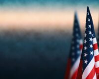 Three American flags on the right side of a background image