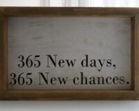 Sign that says "365 New days. 365 New chances."