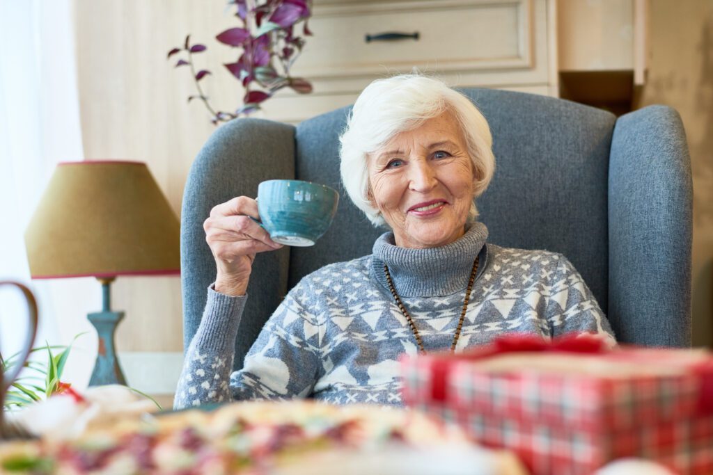 Happy Senior Lady Enjoying Winter Tea