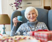 Happy Senior Lady Enjoying Winter Tea