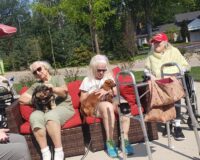 Pet therapy at Manoogian Manor on the patio