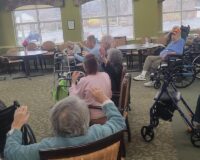 Manoogian Manor residents with limited mobility exercising