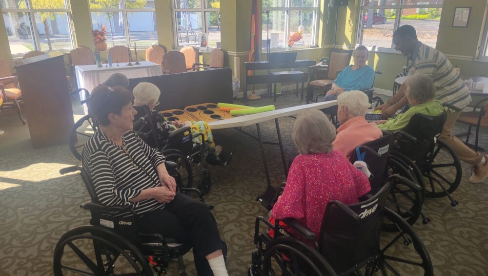 Manoogian Manor residents playing skee ball game