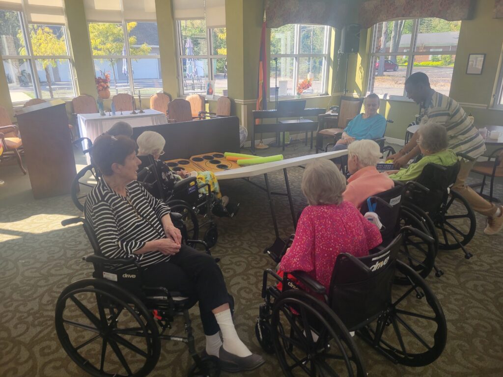 Manoogian Manor residents playing skee ball game