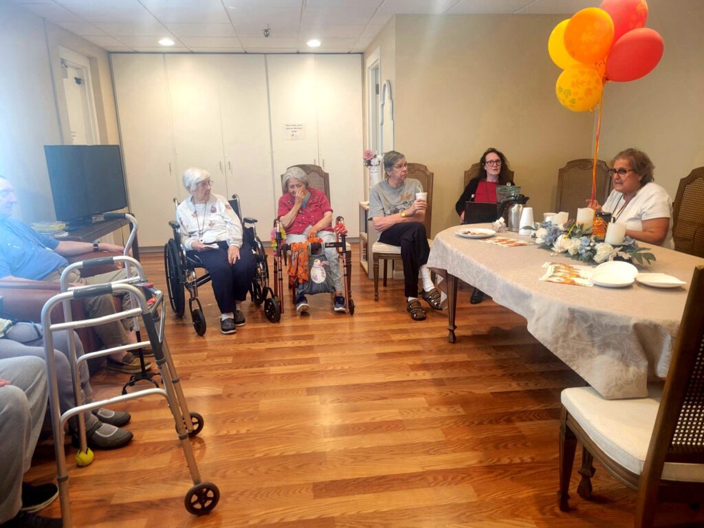 Manoogian Manor residents having tea with the nurses