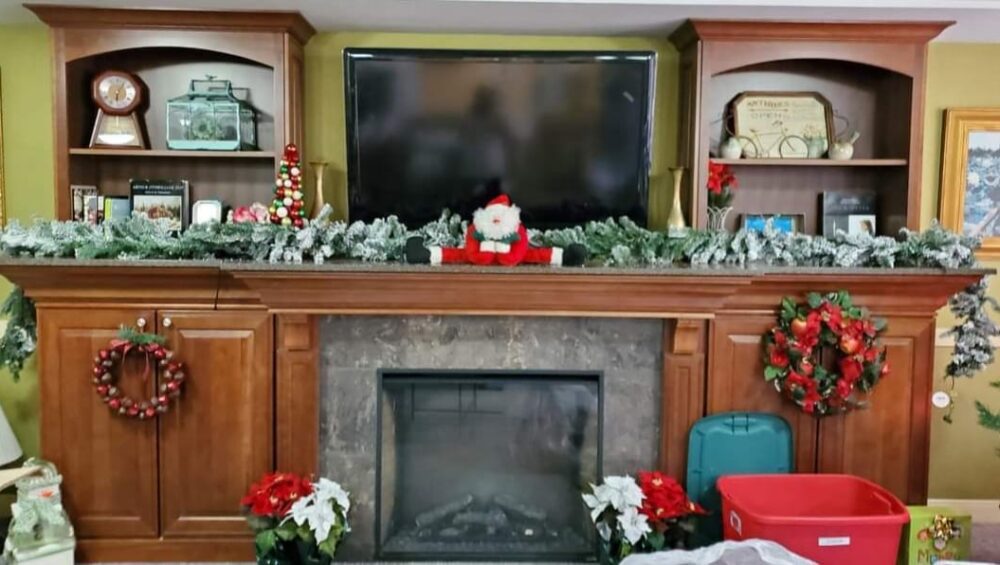 Manoogian Manor fireplace mantle decorated for Christmas.