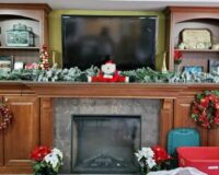 Manoogian Manor fireplace mantle decorated for Christmas.