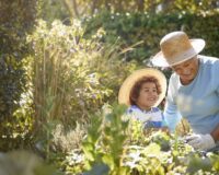 Grandmother and child gardening outdoors
